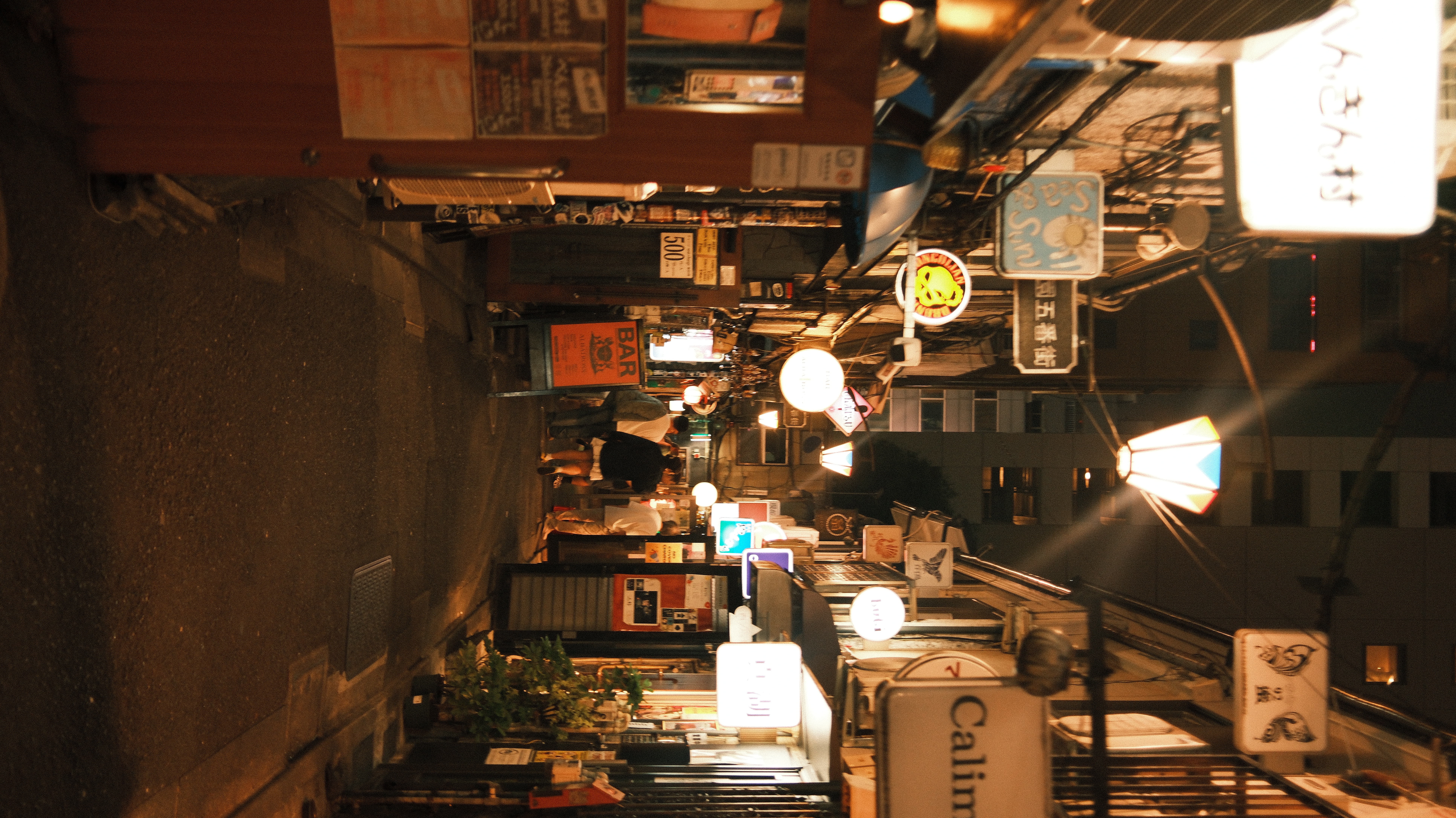 Golden Gai alleyway at night with neon signs, Shinjuku Tokyo