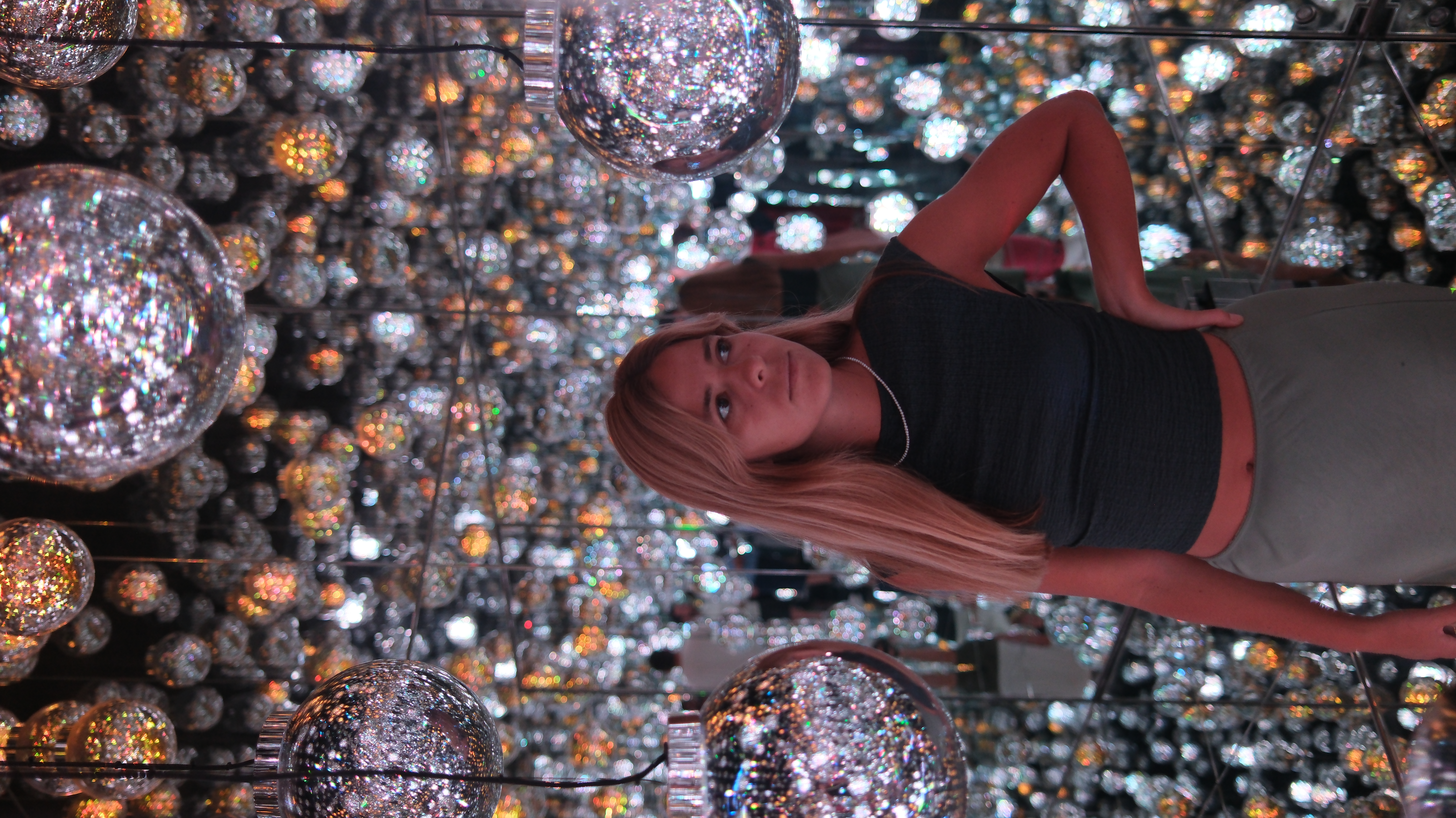 Maria inside TeamLab Borderless mirror ball room, close-up