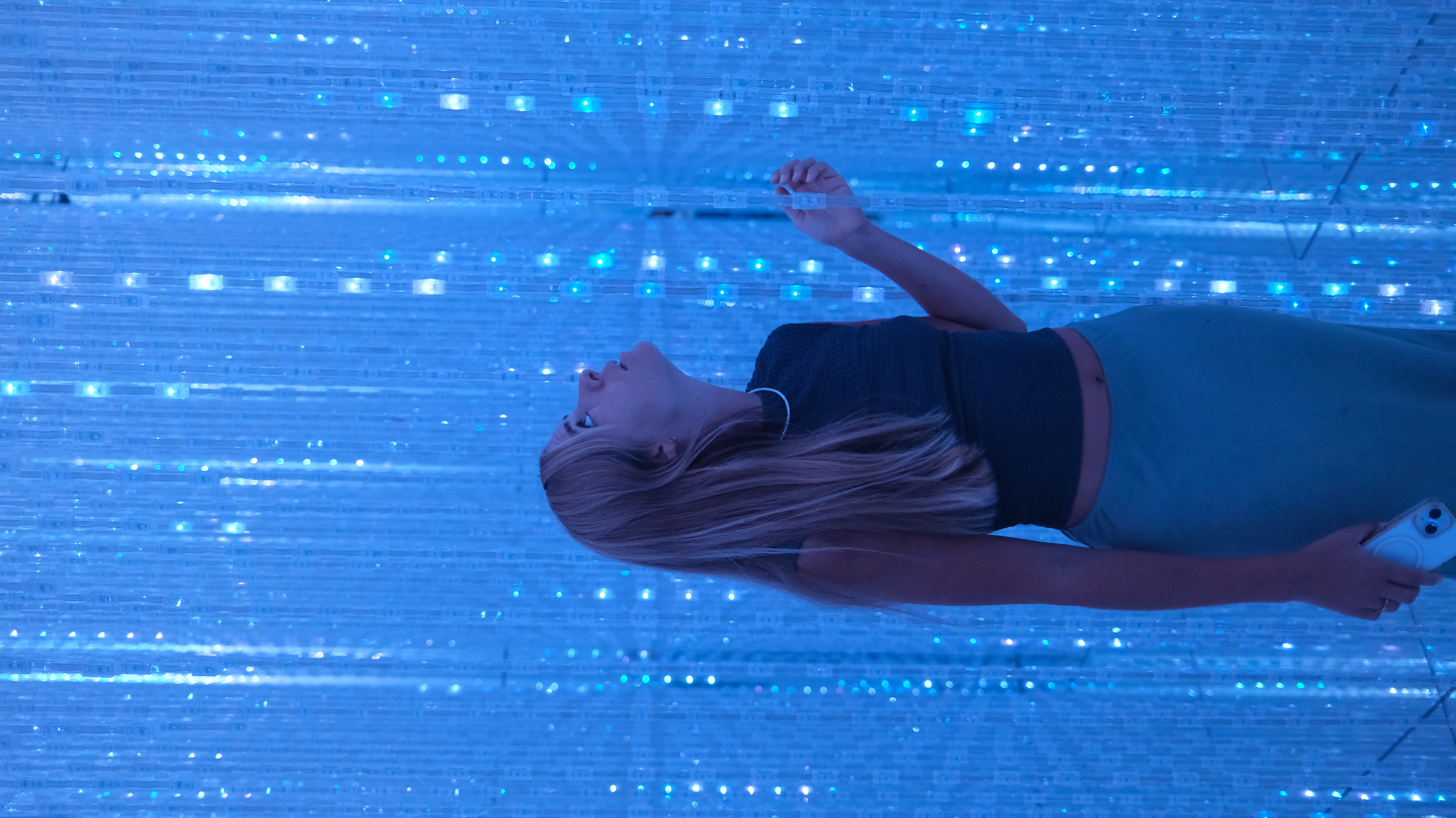 Maria inside TeamLab blue light installation, Tokyo