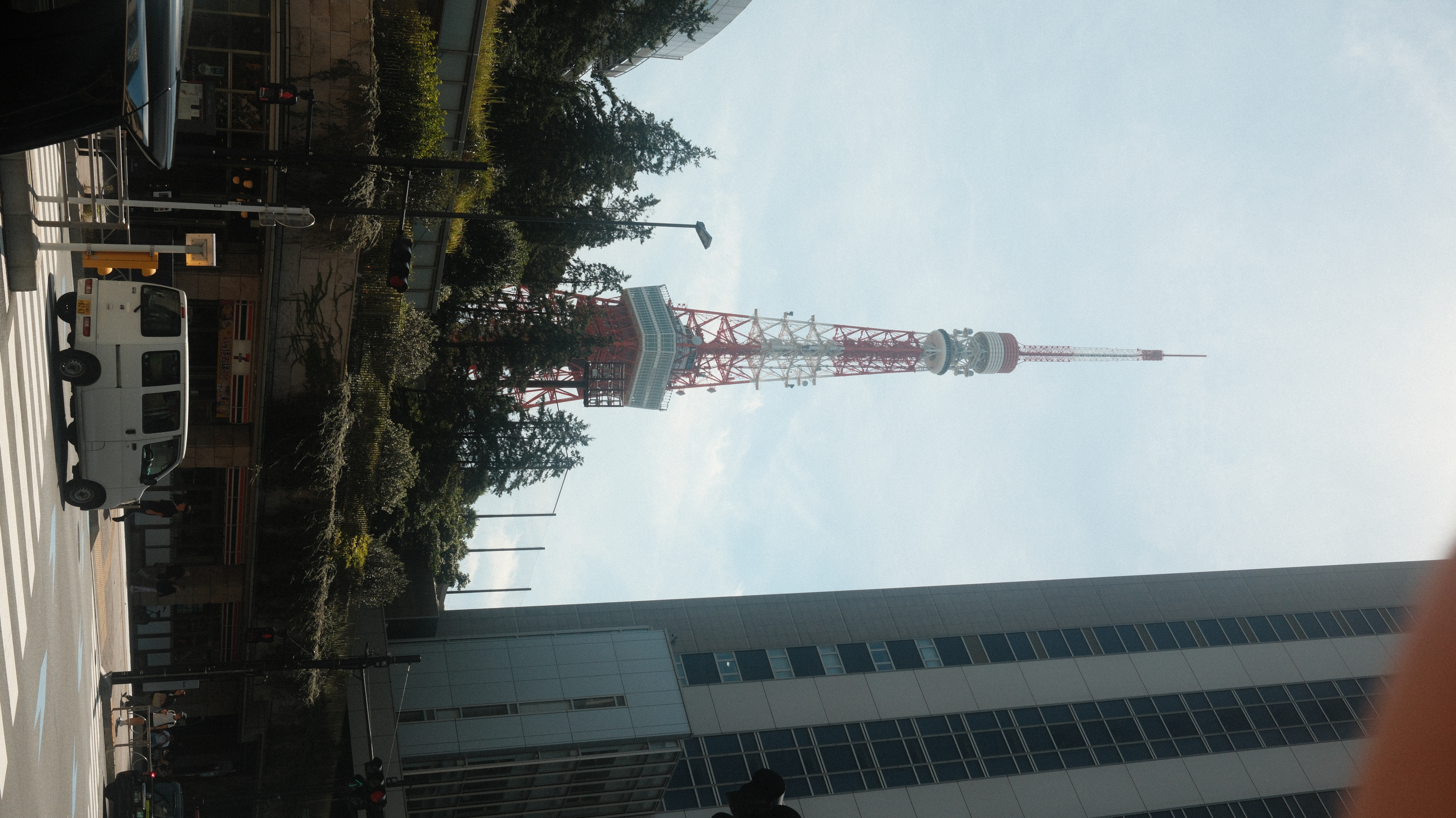 Tokyo Tower visible through buildings and city streets, Tokyo