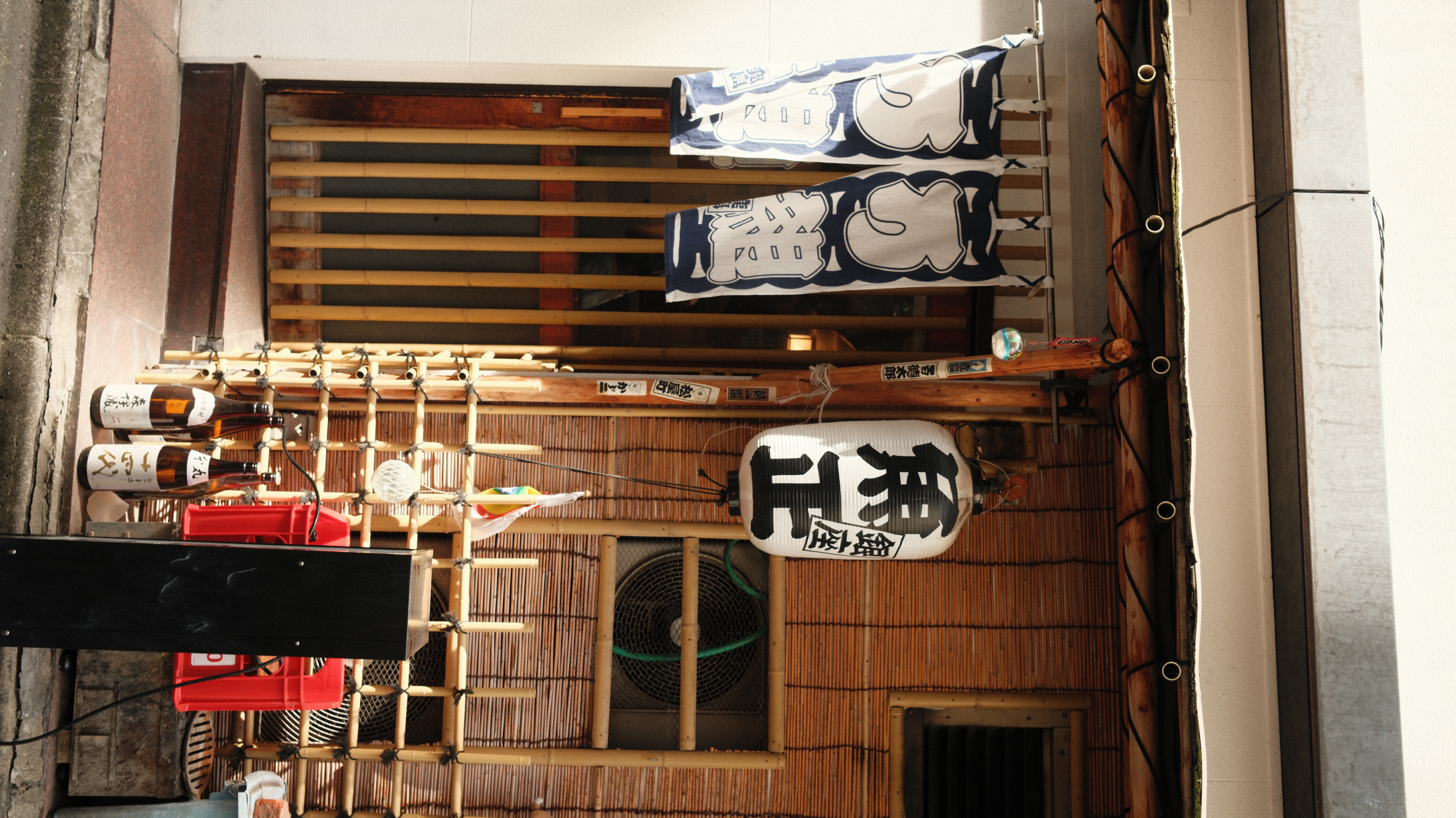 Traditional izakaya exterior with noren curtains, Tokyo