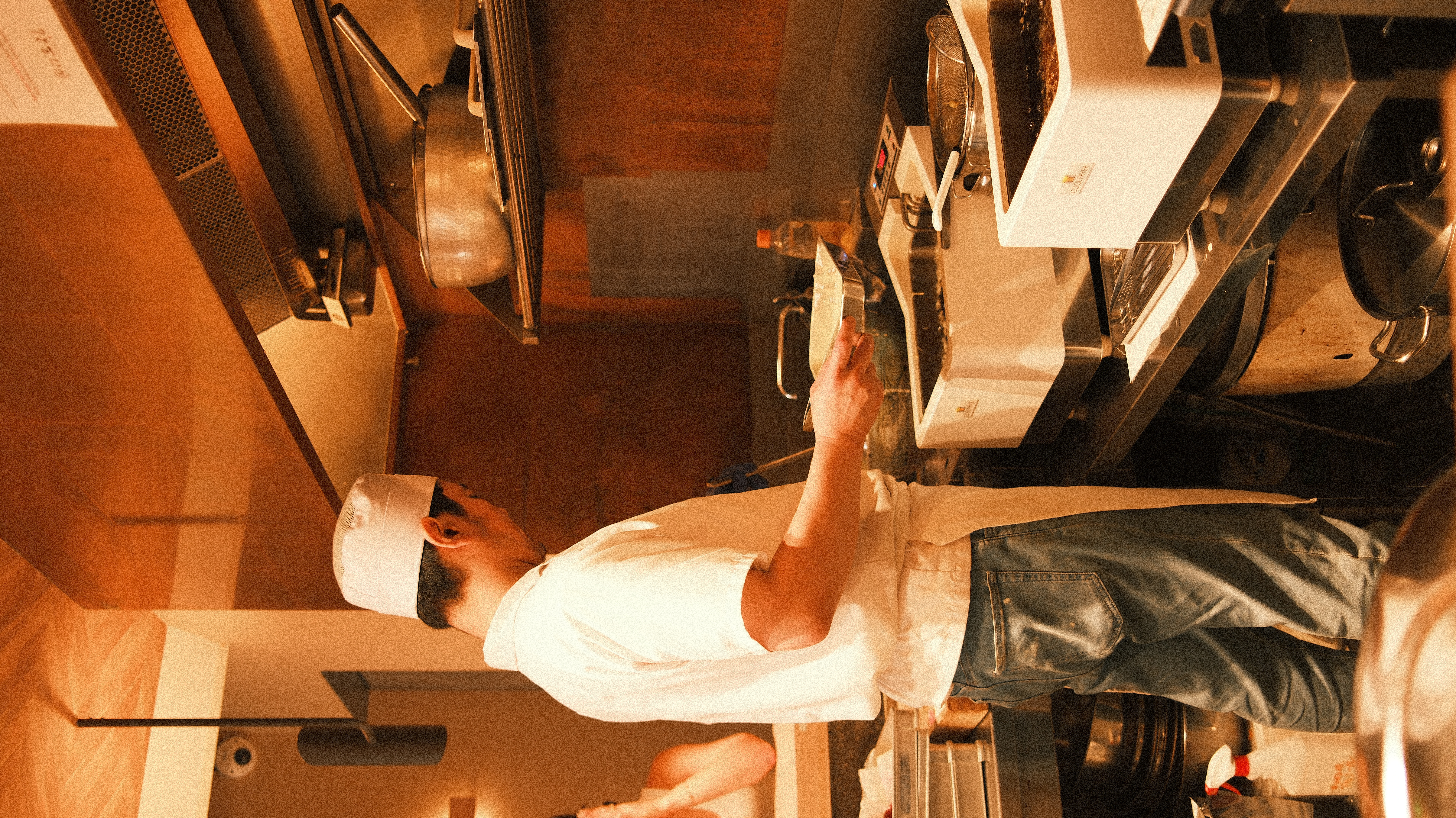 Chef in a Tokyo restaurant kitchen preparing omakase