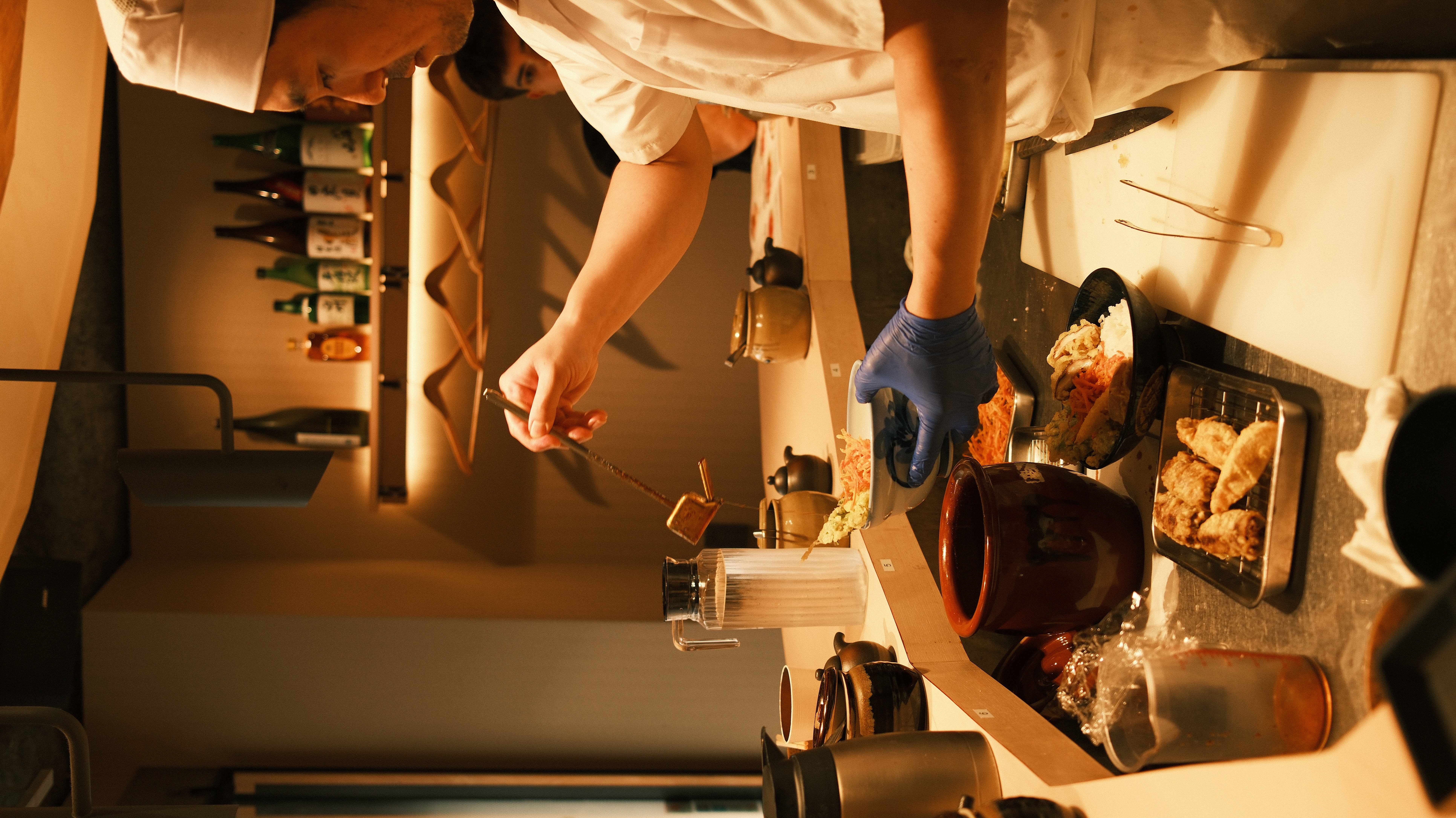 Chef preparing food at counter restaurant Tokyo, omakase