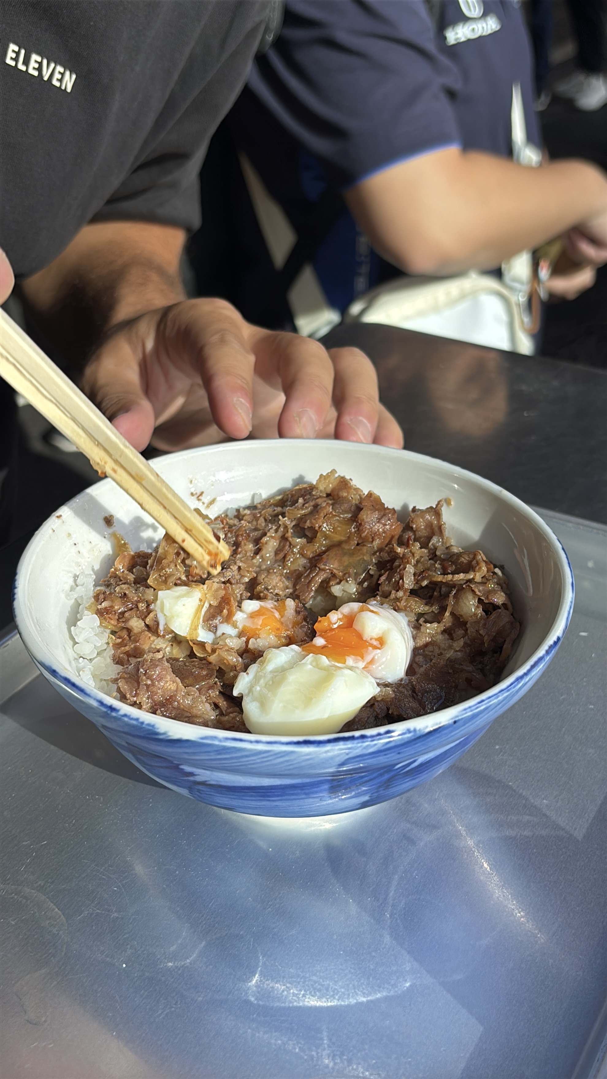 Gyudon beef bowl eaten with chopsticks at a Tokyo restaurant
