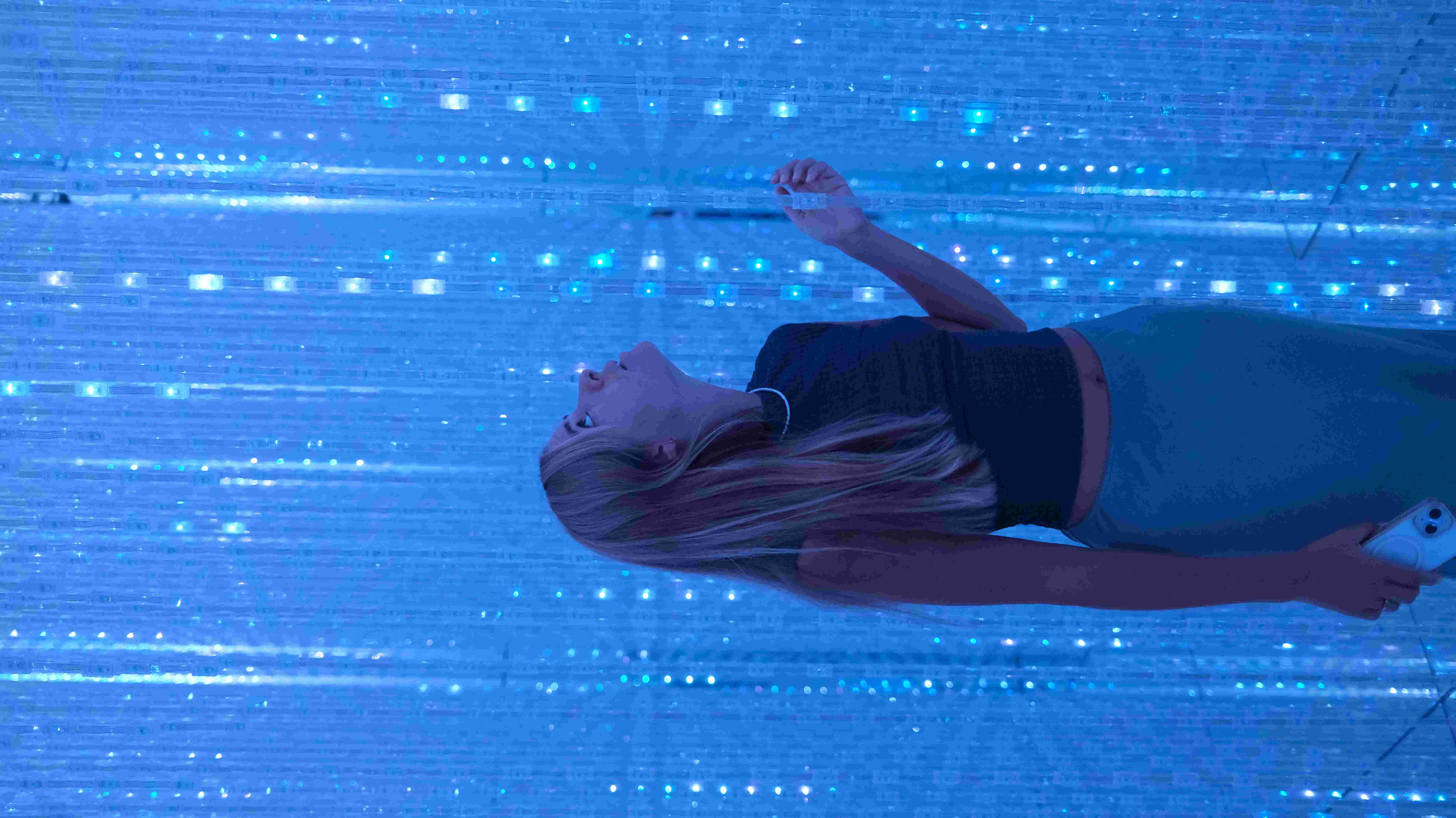 Maria in the blue light installation at TeamLab Borderless, Tokyo